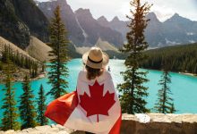woman draped in a flag of canada