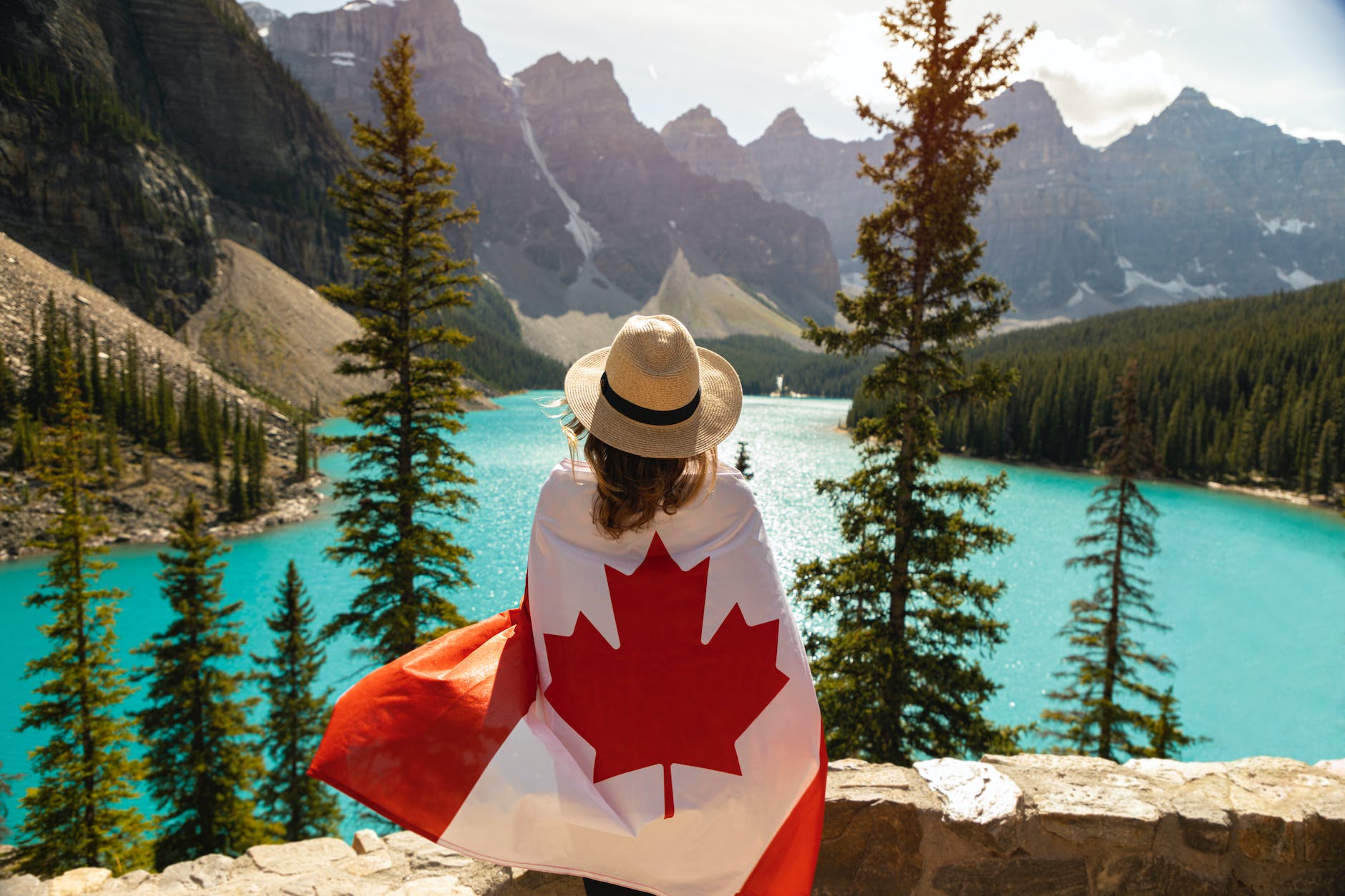 woman draped in a flag of canada